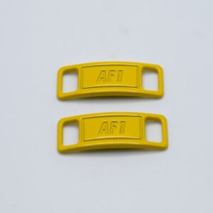 Hebillas amarillas para cordones de zapatillas
